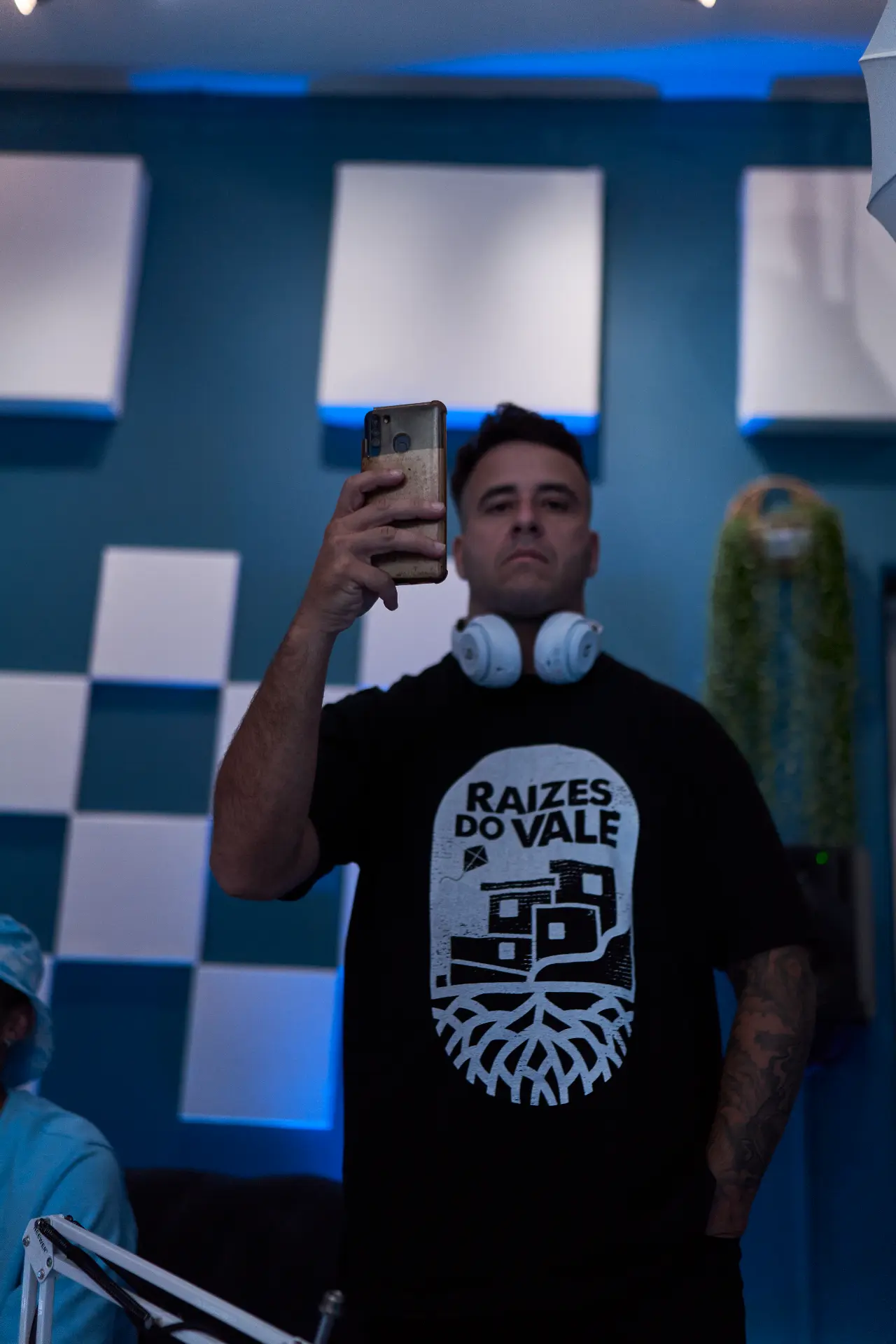Artist with headphones capturing a moment inside the studio